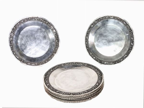 A Set of Twelve Silver Underplates