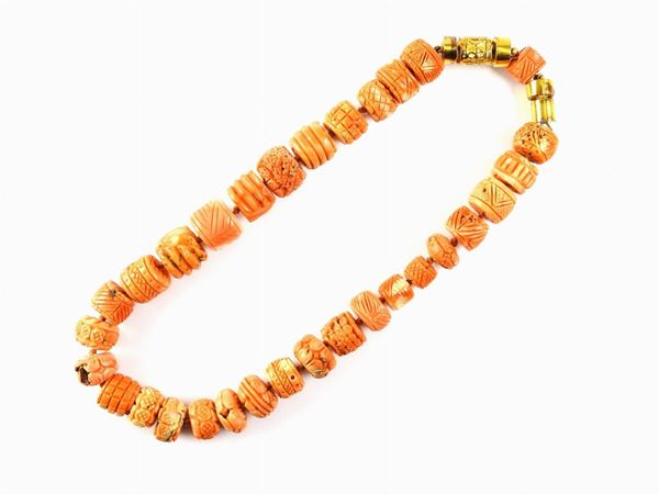 Pink coral necklace with yellow gold ornaments
