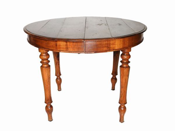 A Round Walnut Dining Table