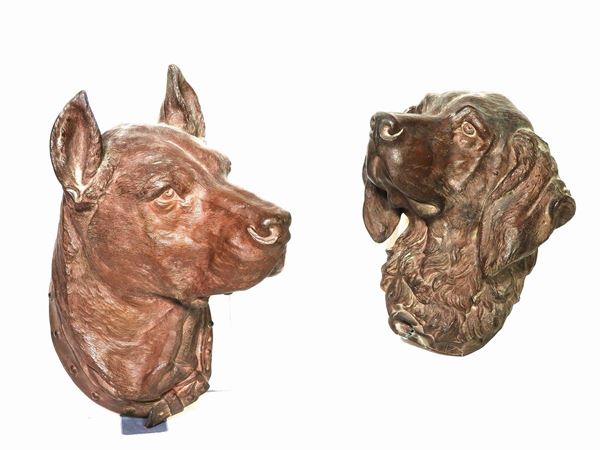Two Patinated Metal Trophies of Dog Heads