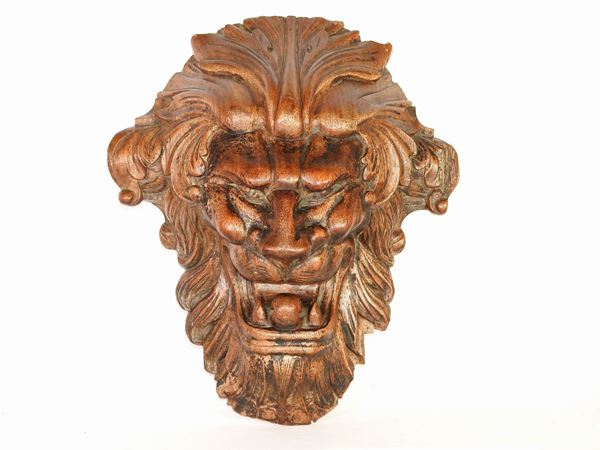 A Carved Wooden Lion Head