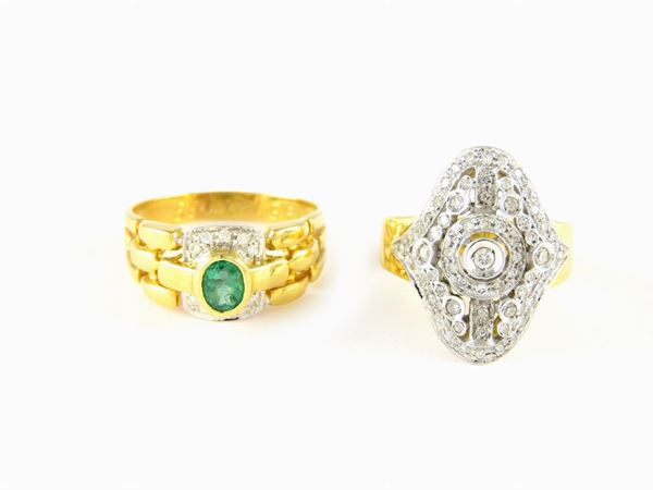 Two white and yellow gold rings with diamonds and emerald