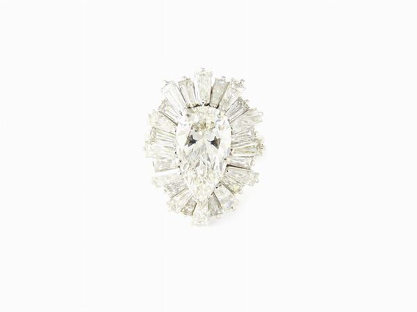 White gold daisy ring with central pear shape cut diamond