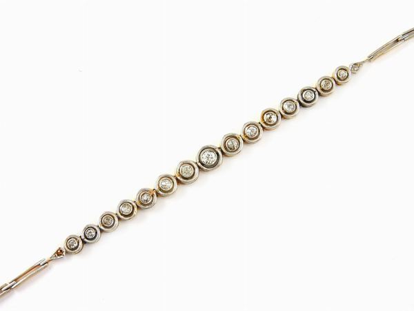 White and yellow gold graduated half tennis bracelet with diamonds