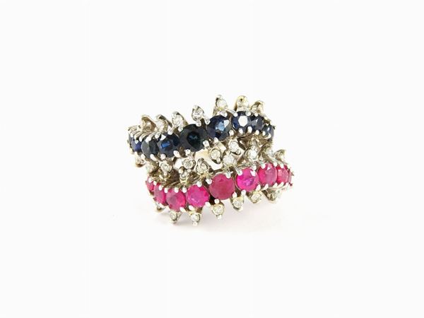 Pair of white gold wavy rings with diamonds, rubies and sapphires