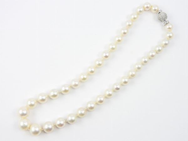 Graduated cultured South Sea pearls necklace with white gold and diamonds round clasp