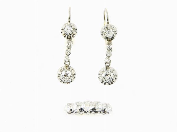 Demi parure of white and yellow gold and platinum ring and ear pendants with diamonds