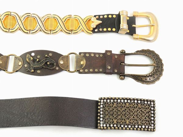 Three leather and metal belts
