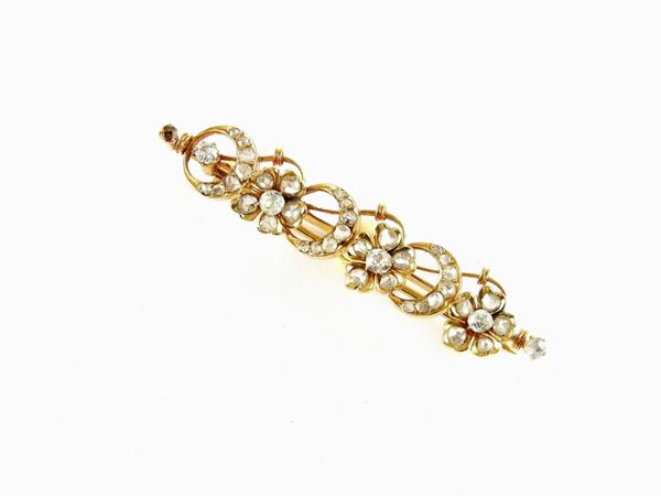 Yellow gold bar brooch with diamonds