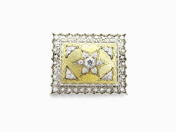 White and yellow gold flat brooch with diamonds