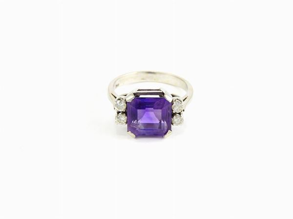 White gold ring with diamonds and amethyst quartz