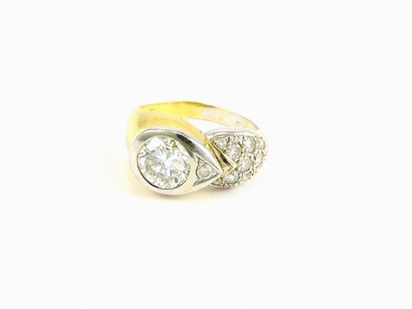 White and yellow gold ring with diamonds