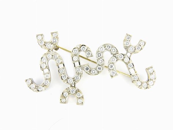 White gold design brooch with diamonds