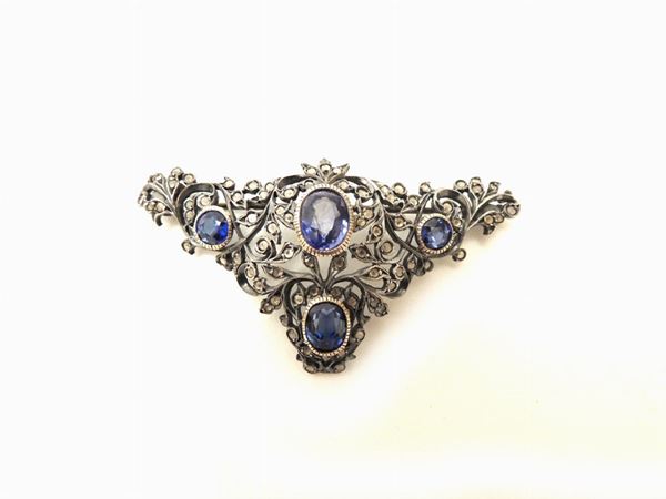 Silver brooch with synthetic stones
