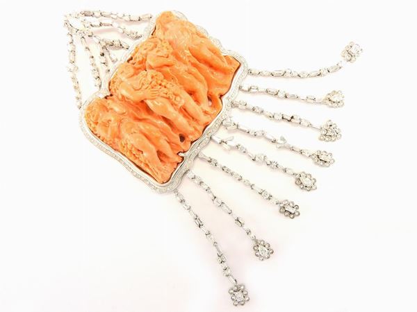 Noticeable white gold pendant with diamonds and carved coral