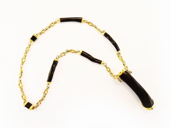 Yellow gold and black coral necklace
