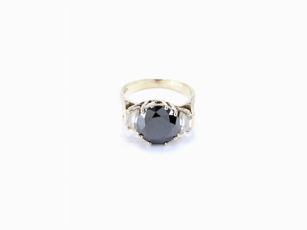 White gold ring with black diamond and colourless diamonds
