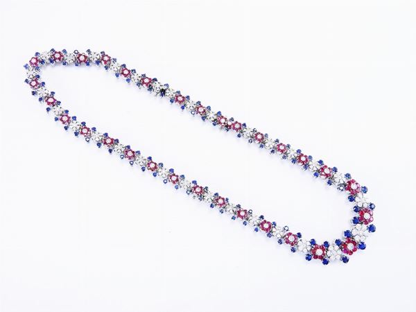 White gold graduated necklace with diamonds, rubies and sapphires