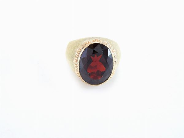 Yellow gold Buccellati domed ring with brownish red zircon