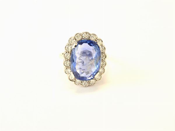White gold daisy ring with diamonds and natural sapphire