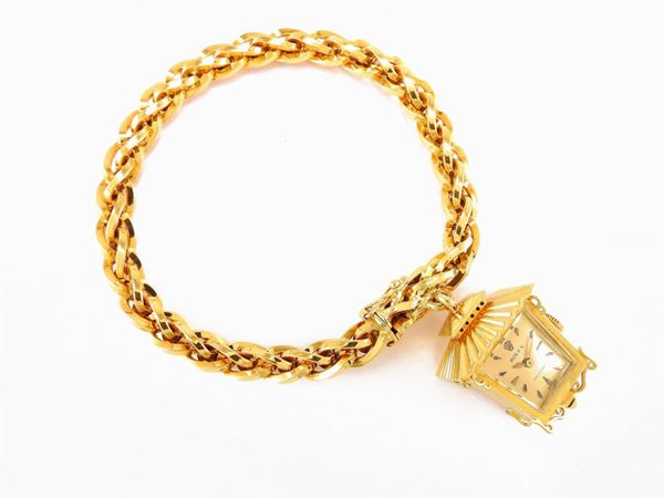 Yellow gold bracelet with Rolex watch pendant