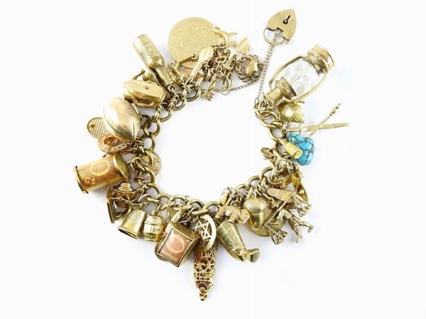 Bracelet with mostly 9Kt pink and yellow gold "charms"