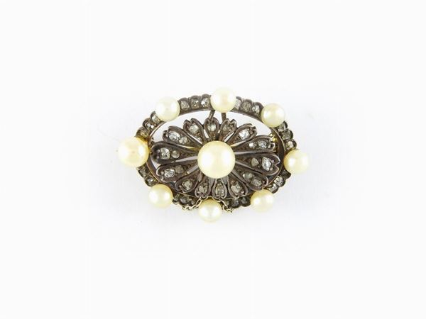 Silver and yellow gold brooch with diamonds and likely natural pearls
