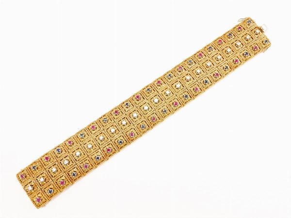 Yellow gold bracelet with diamonds, rubies and sapphires
