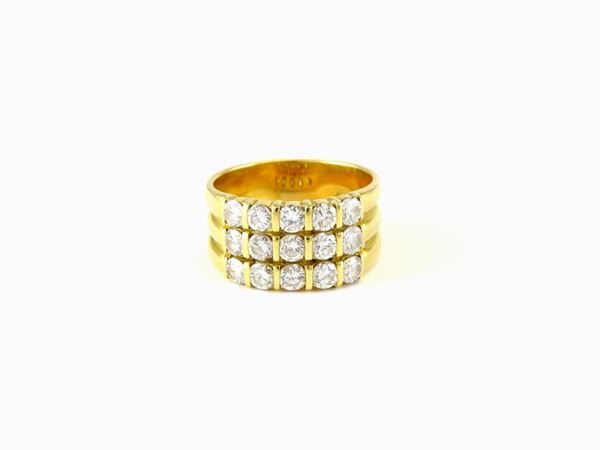 Yellow gold band ring with diamonds