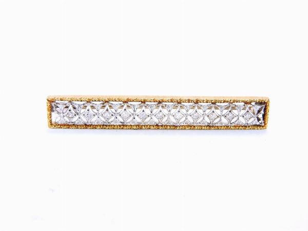 Yellow and white gold brooch with diamonds