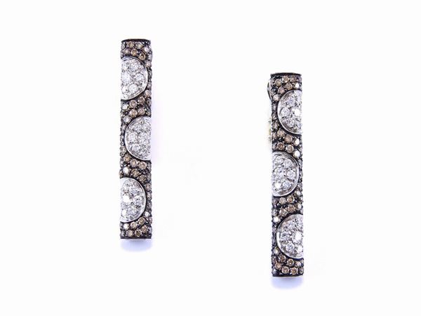 White gold Koesia ear pendants with colourless and brown diamonds