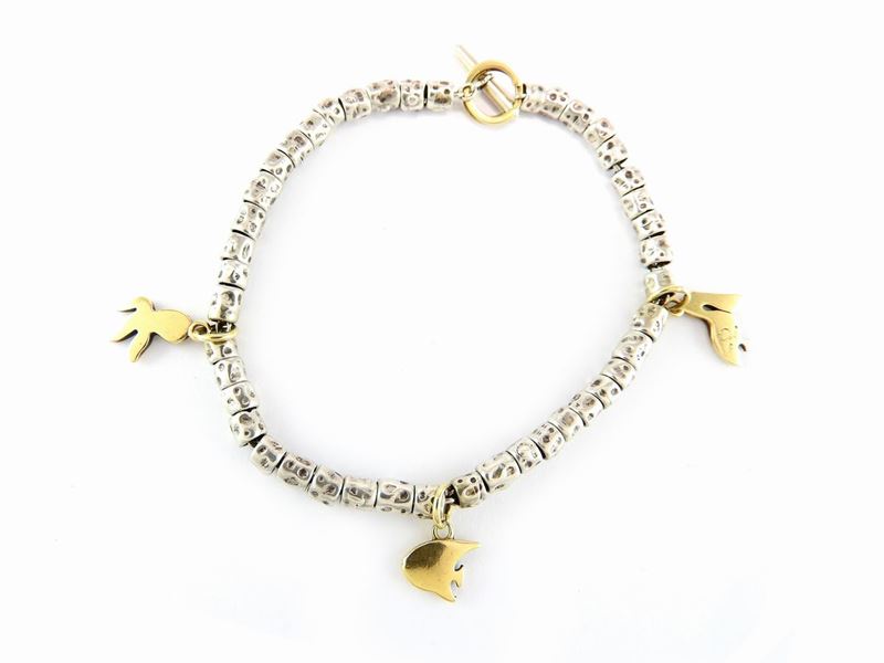 Bracciale "charms" a Soggetto Animalier Pomellato in Oro Giallo e Argento