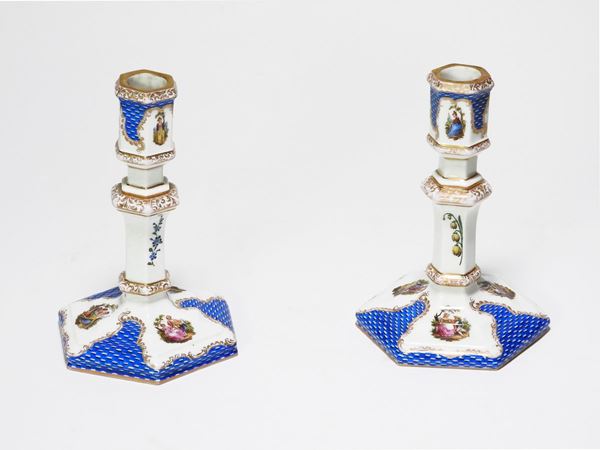 A Pair of Painted Porcelain Candlesticks