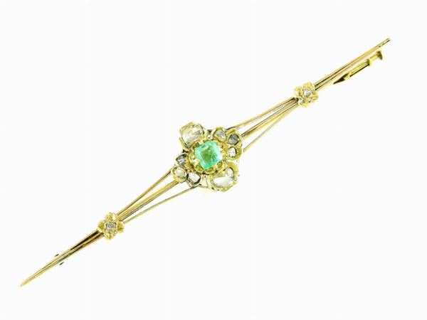 Yellow gold bar brooch with diamonds and emerald
