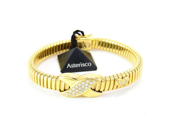 Bracciale tubogas "Asterisco" in oro giallo e diamanti