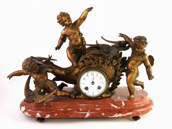 A Gilded Metal Mantel Clock
