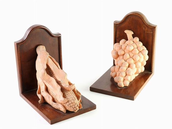A Pair of Wooden and Earthenware Bookends