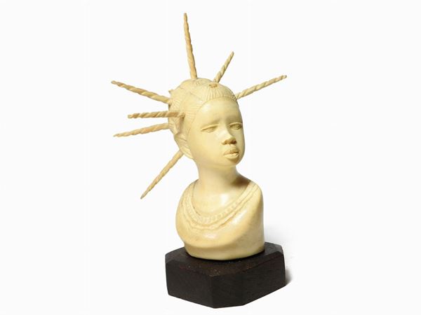 *A Carved Ivory Bust of a Young Woman