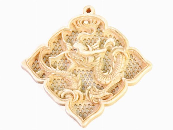 *A Carved Ivory Pendant