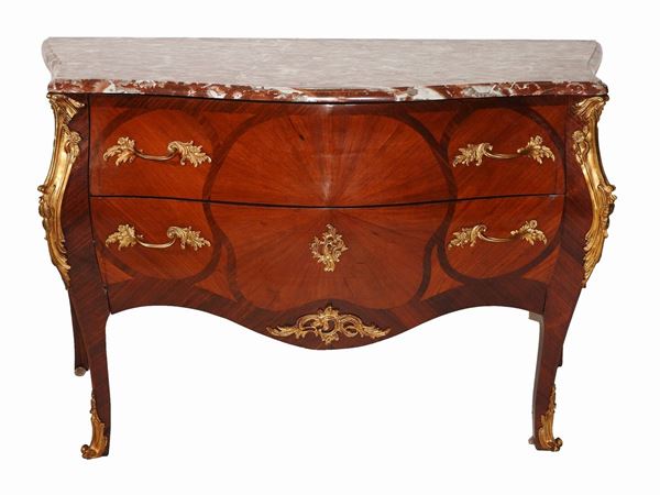 A Walnut and Rosewood Chest of Drawers