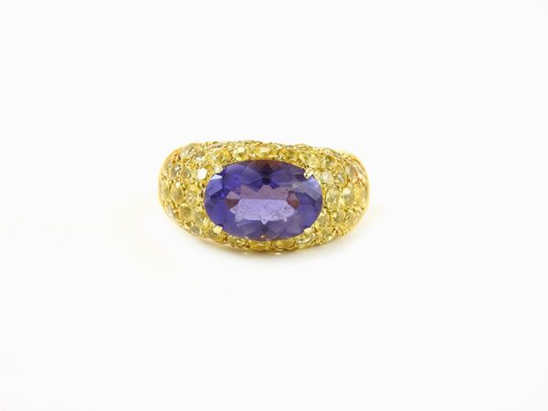 Yellow gold band ring with yellow sapphires and iolite