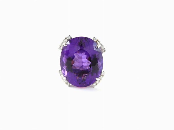 White gold ring with diamonds and amethyst quartz