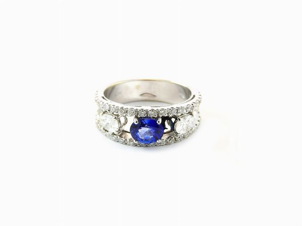 White gold ring with diamonds and sapphire
