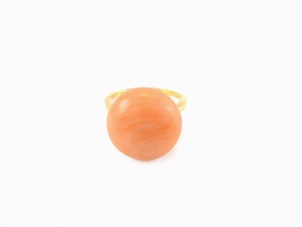 Yellow gold ring with orange coral
