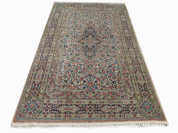 A Persian Kirman Carpet