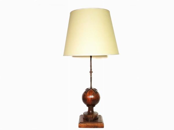 A Wooden and Wrought Iron Table Lamp