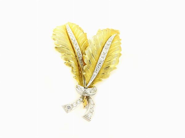 White and yellow gold brooch with diamonds