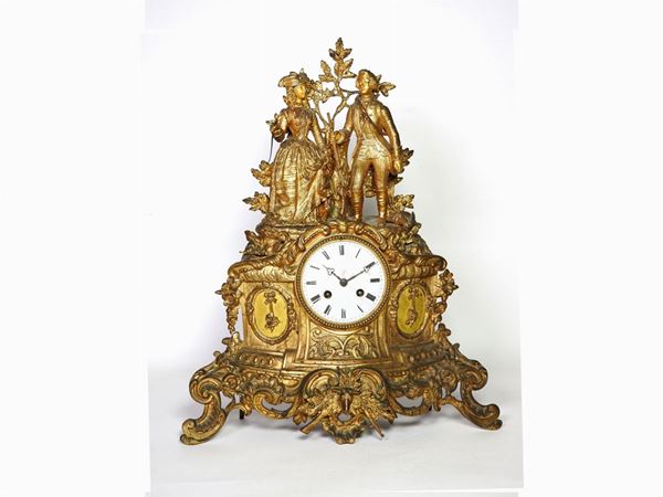 A Gilded Metal Mantel Clock