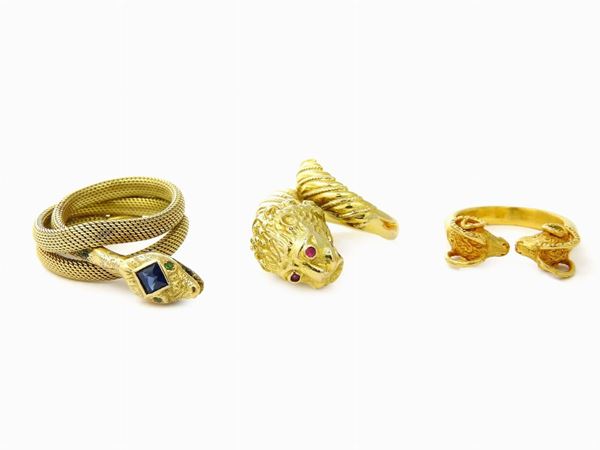 Three yellow gold animalier-shaped rings with sappire and rubies
