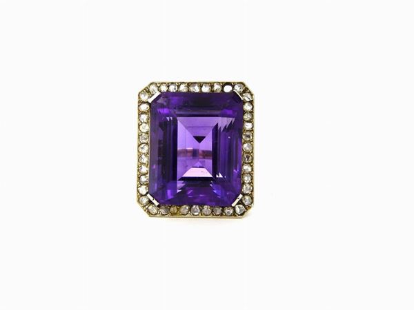White gold ring with diamonds and big amethyst quartz